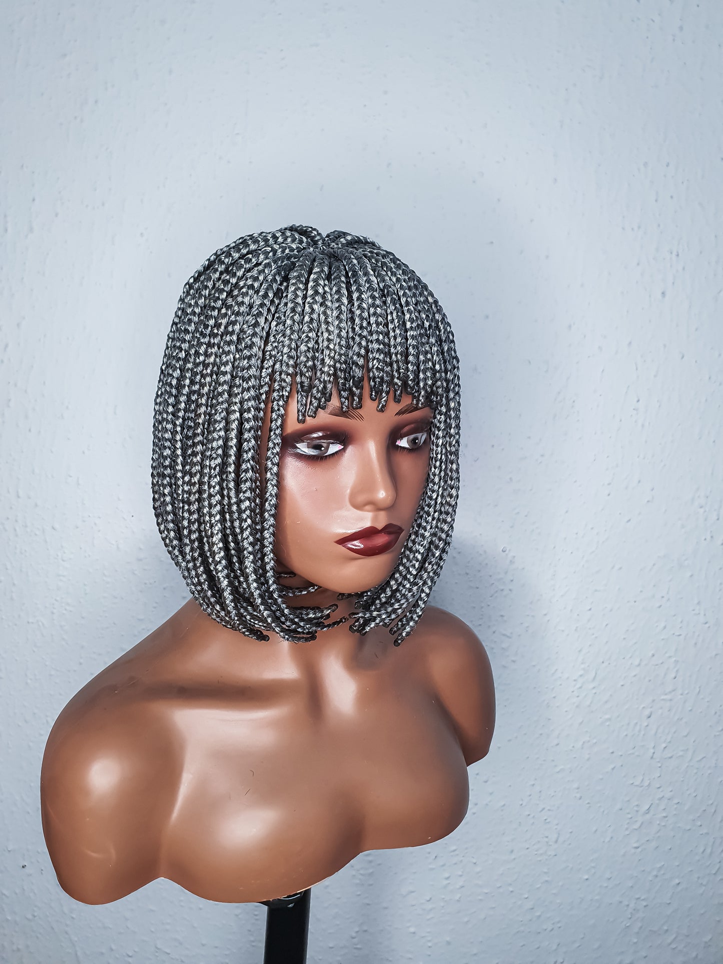 Side view Gray bob braid wig with bangs on mannequin head ready to wear braided wig