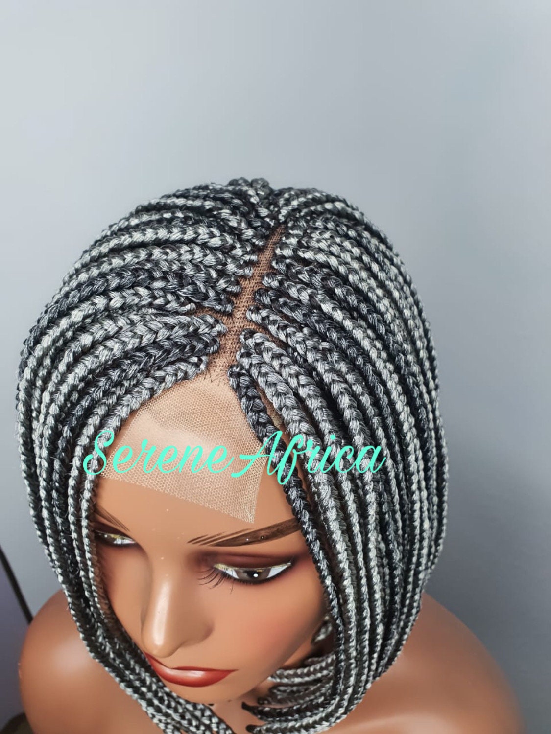 Close up view gray and black bob box braid wig on mannequin head short modern braided wig