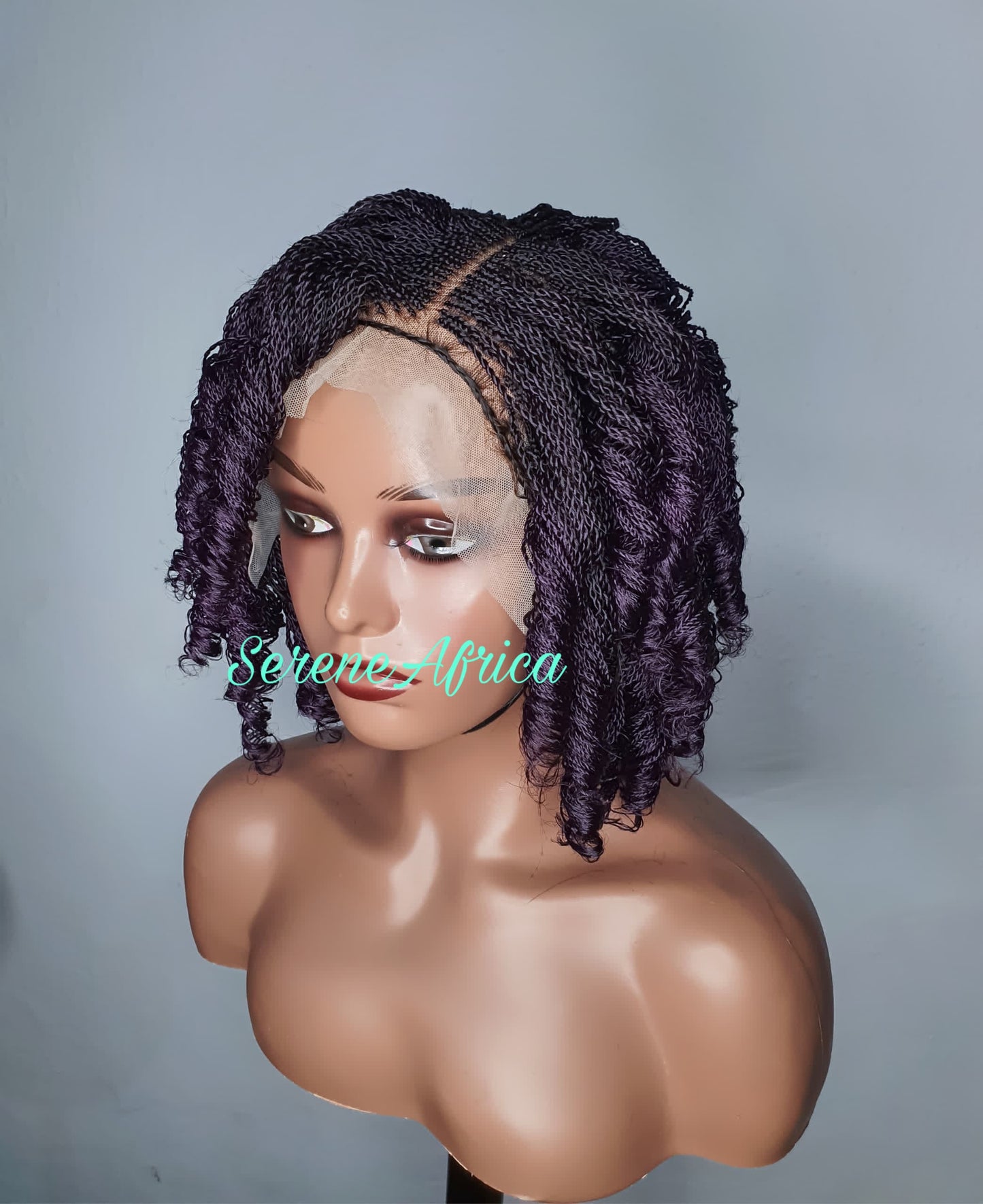 Close-up of micro twists and curled ends on purple braided wig