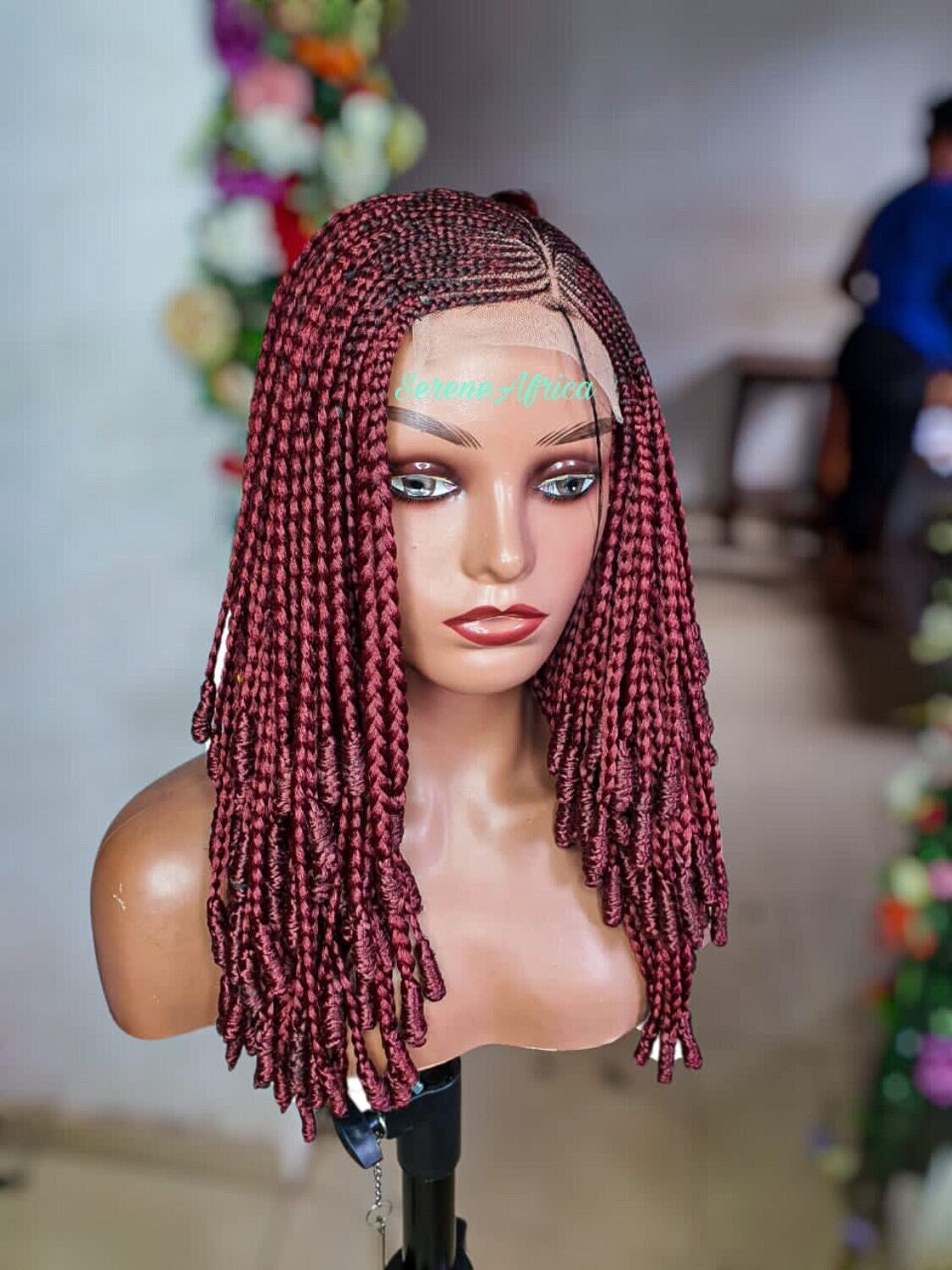 Close-up of Ghana weave braid pattern and sealed ends burgundy color
