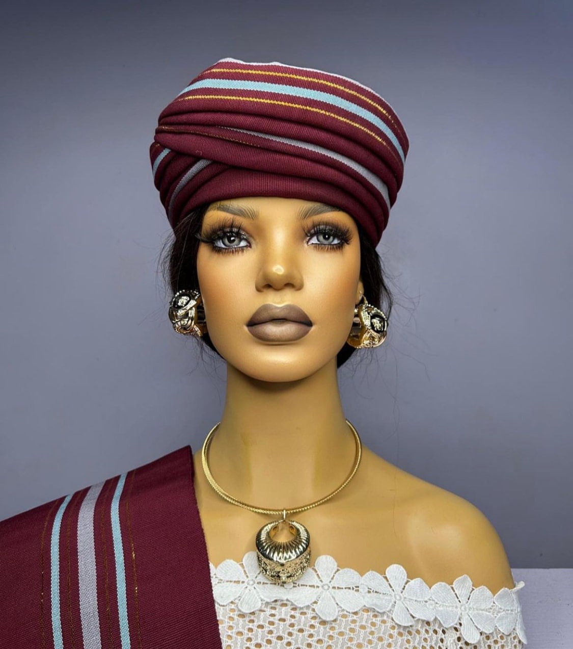 Front view Asooke auto gele headwrap with sash pre tied ready to wear nigerian bridal gele for traditional wedding on a mannnequin