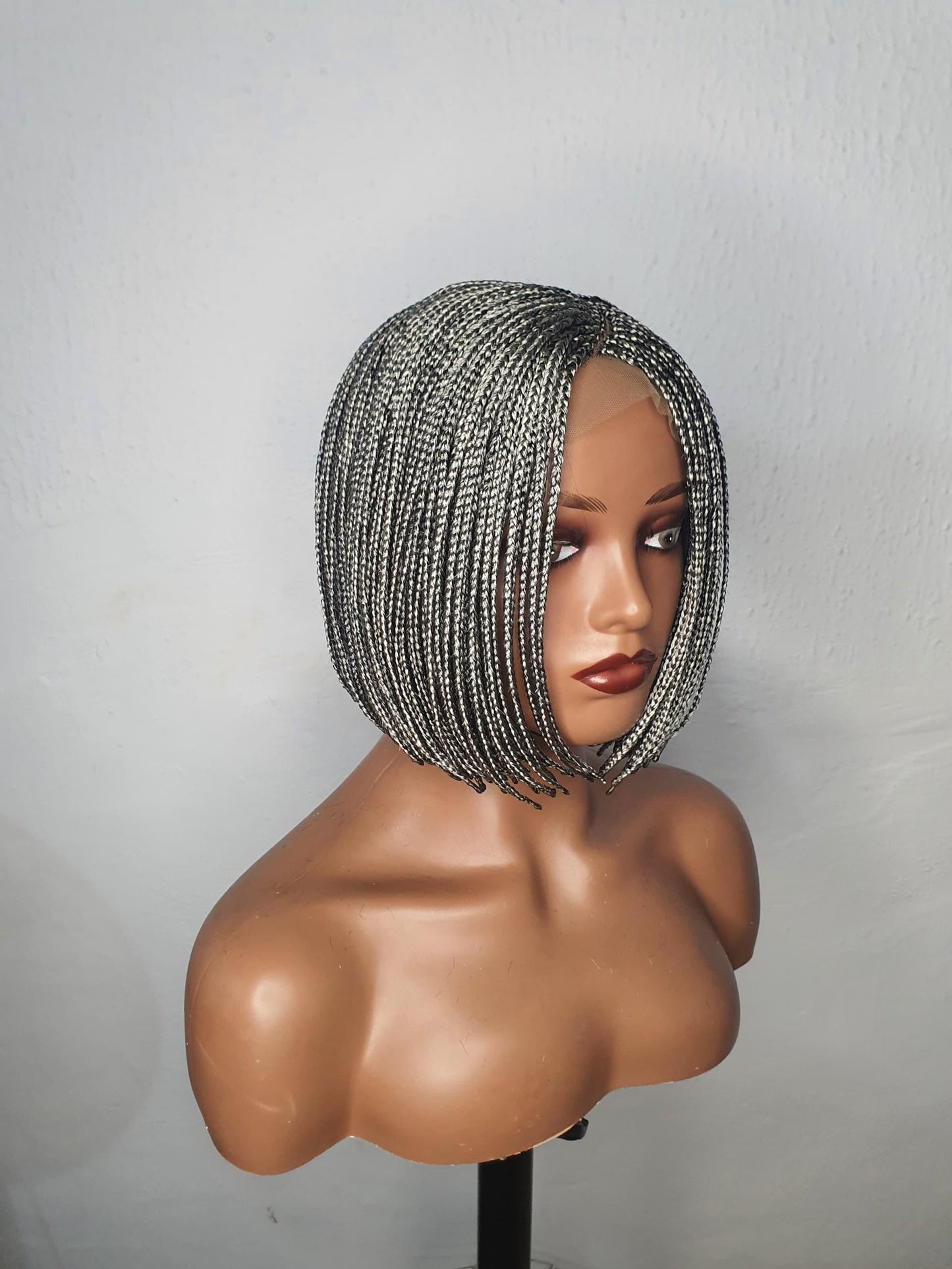 Side view gray C-cut bob box braid wig on mannequin head sleek modern braided wig