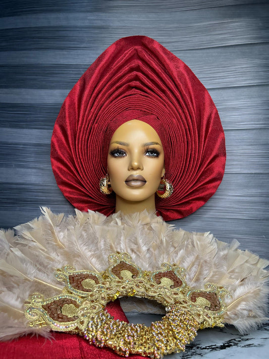 Woman wearing red wine auto gele elegant traditional wedding look