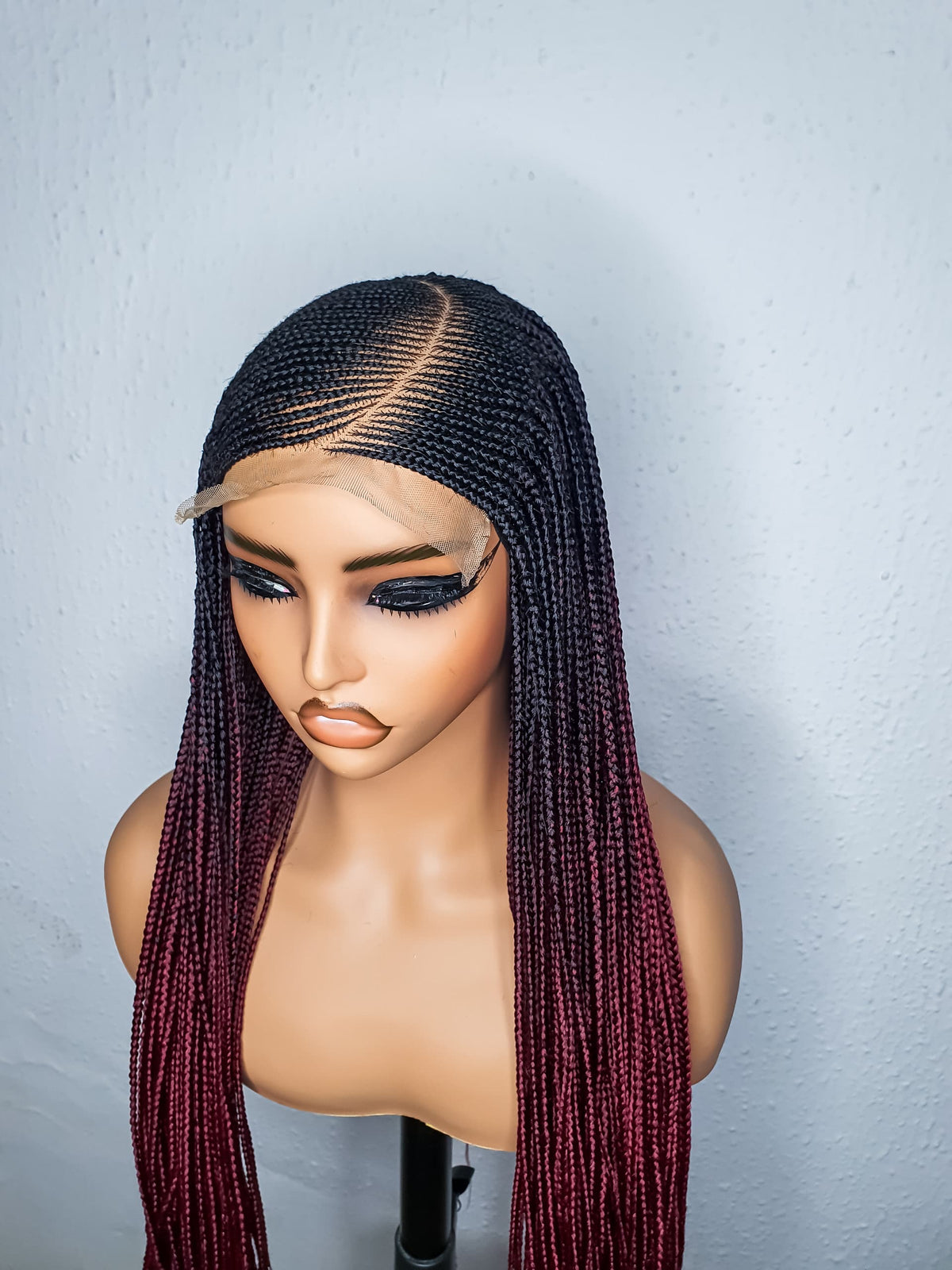 Three quarter view of color 2 and burgundy ombré cornrow wig