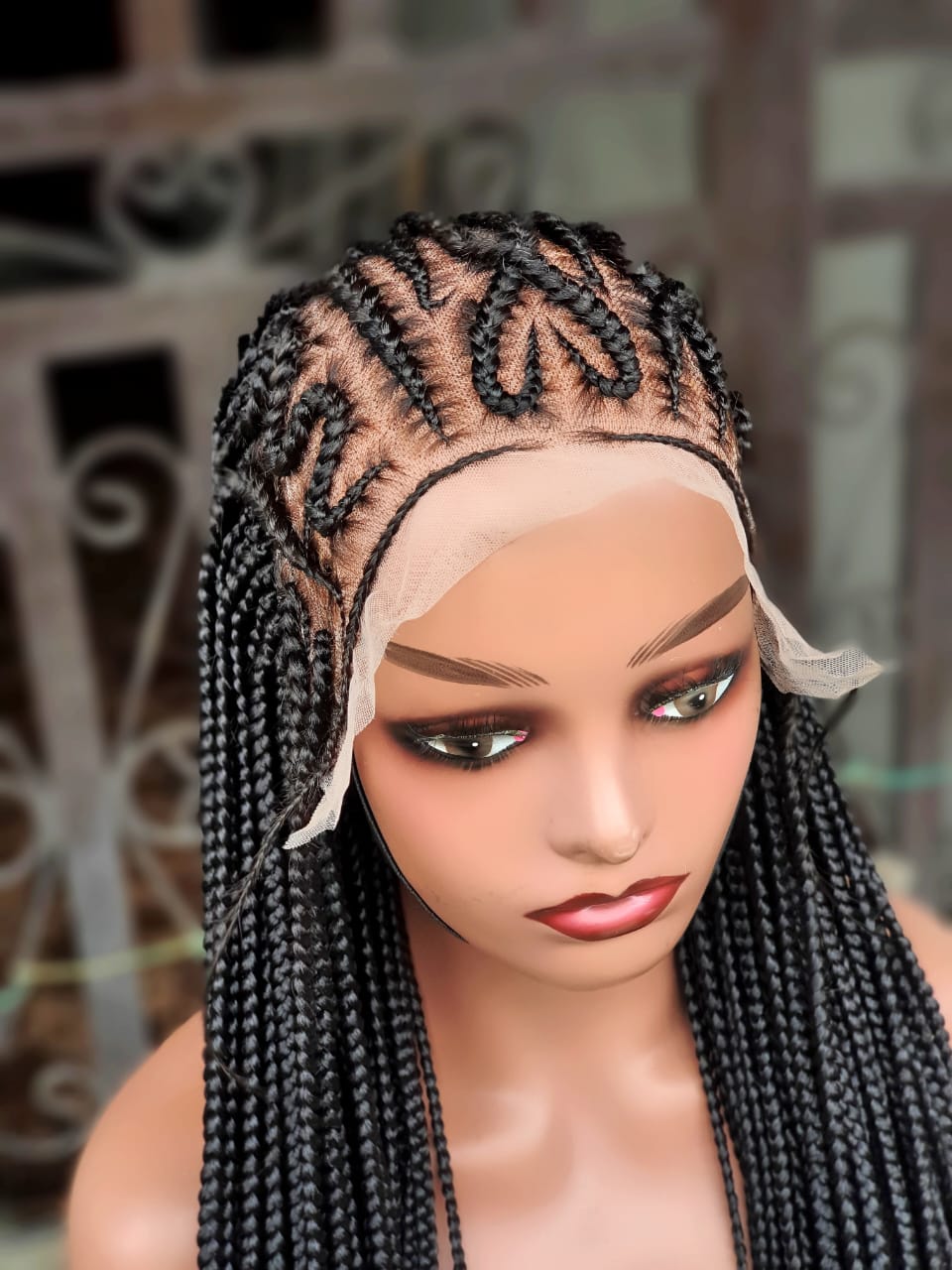 Front view showing curved Fulani cornrows and front lace