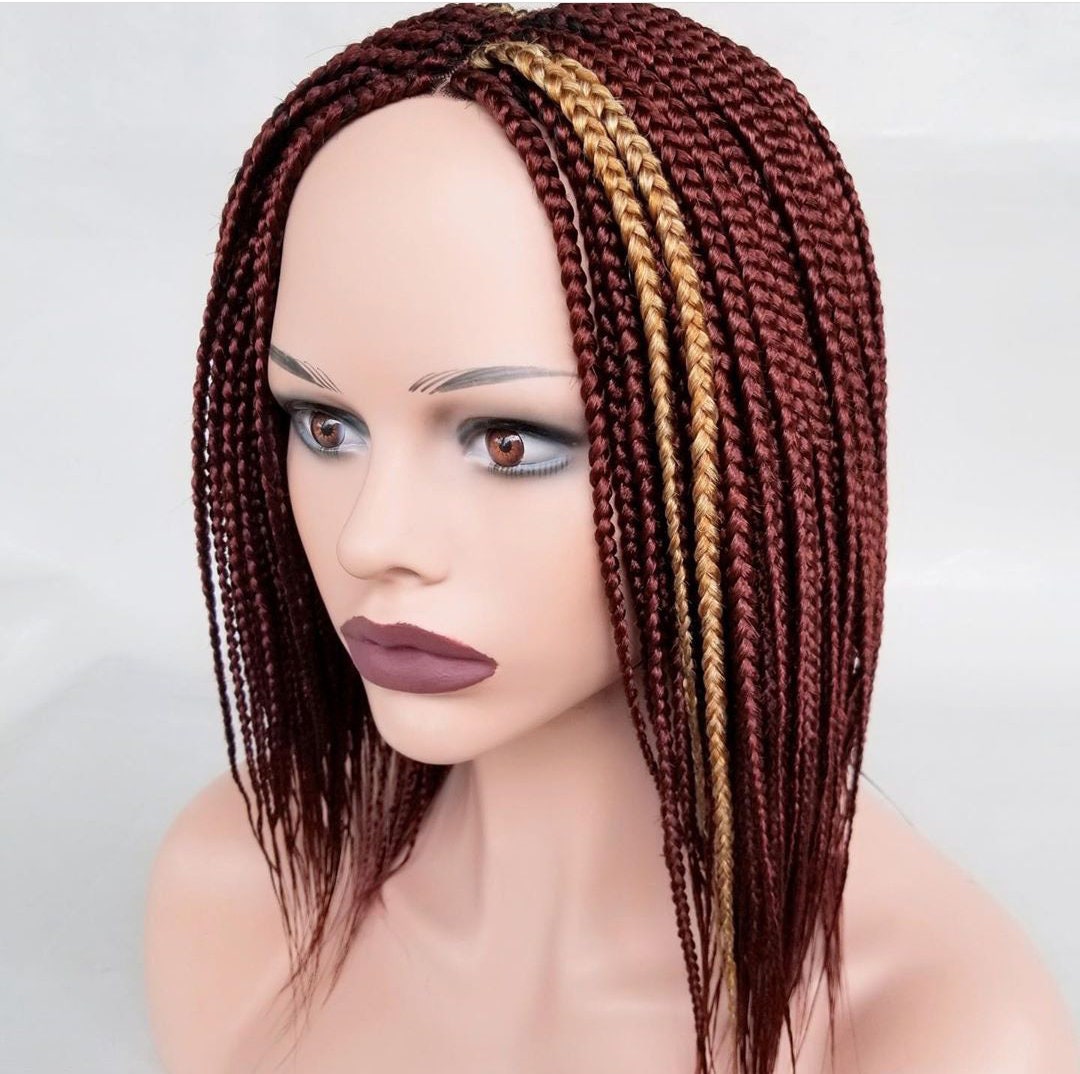 Short burgundy box braid wig with gold highlights on mannequin head braided wig
