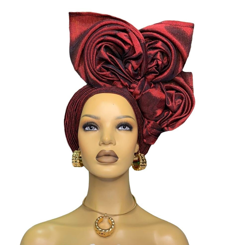 Wine asooke auto gele pre tied ready to wear nigerian bridal headwrap for traditional wedding on a mannequin.