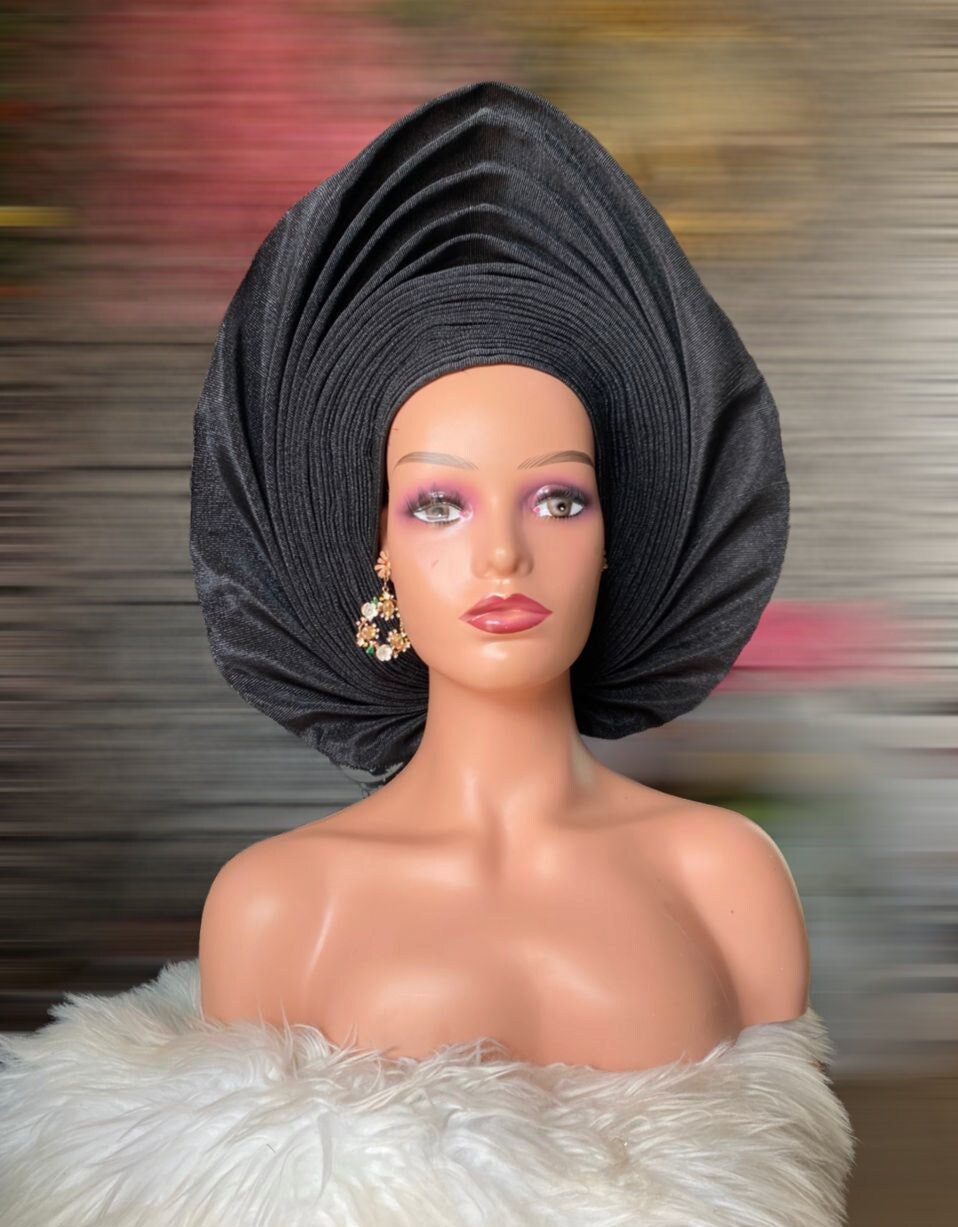 Black asooke auto gele pre tied ready to wear nigerian bridal headwrap for traditional wedding on a mannequine