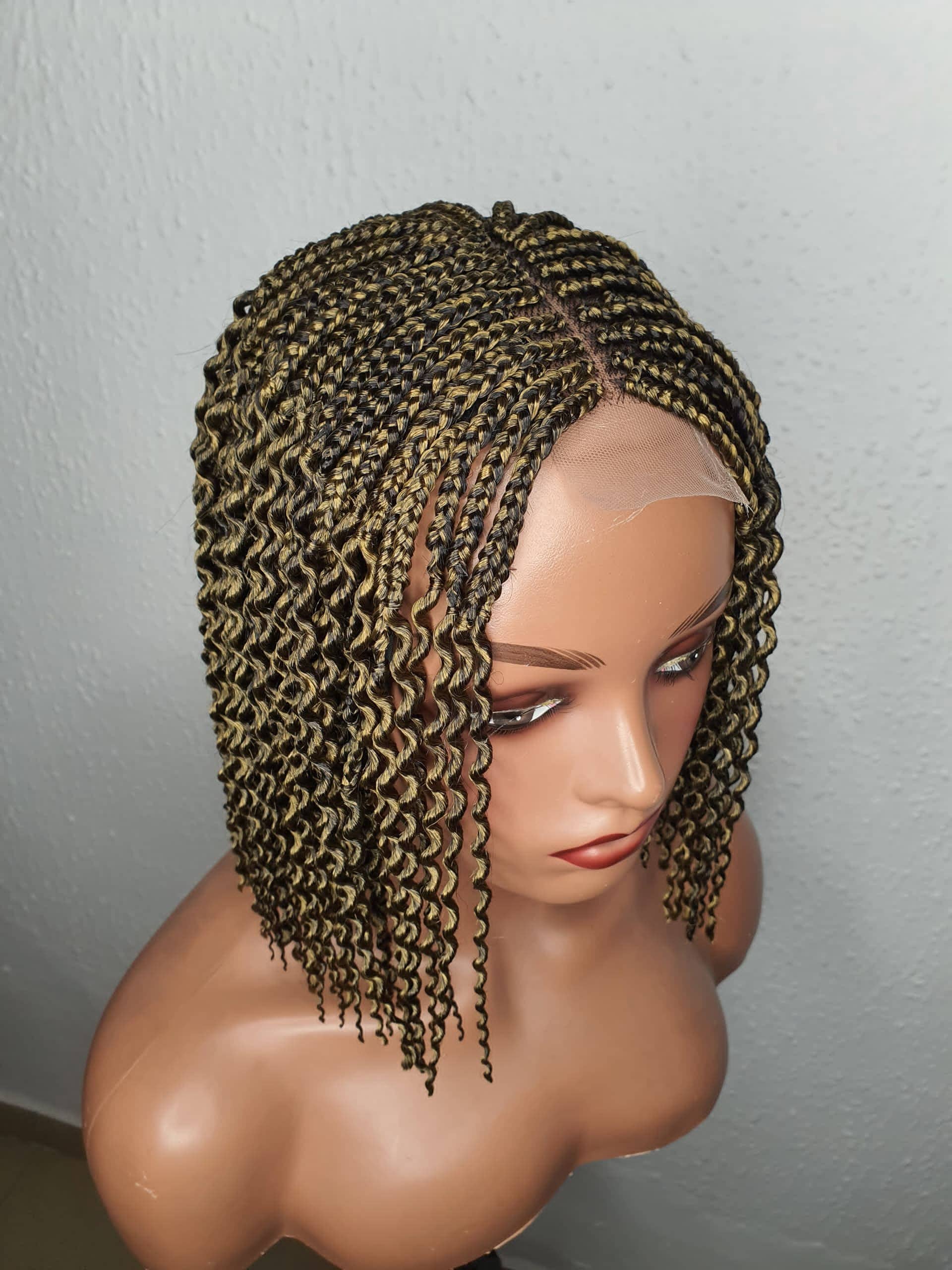 Close up view gold Black box braid wig with highlights on mannequin head braided wig
