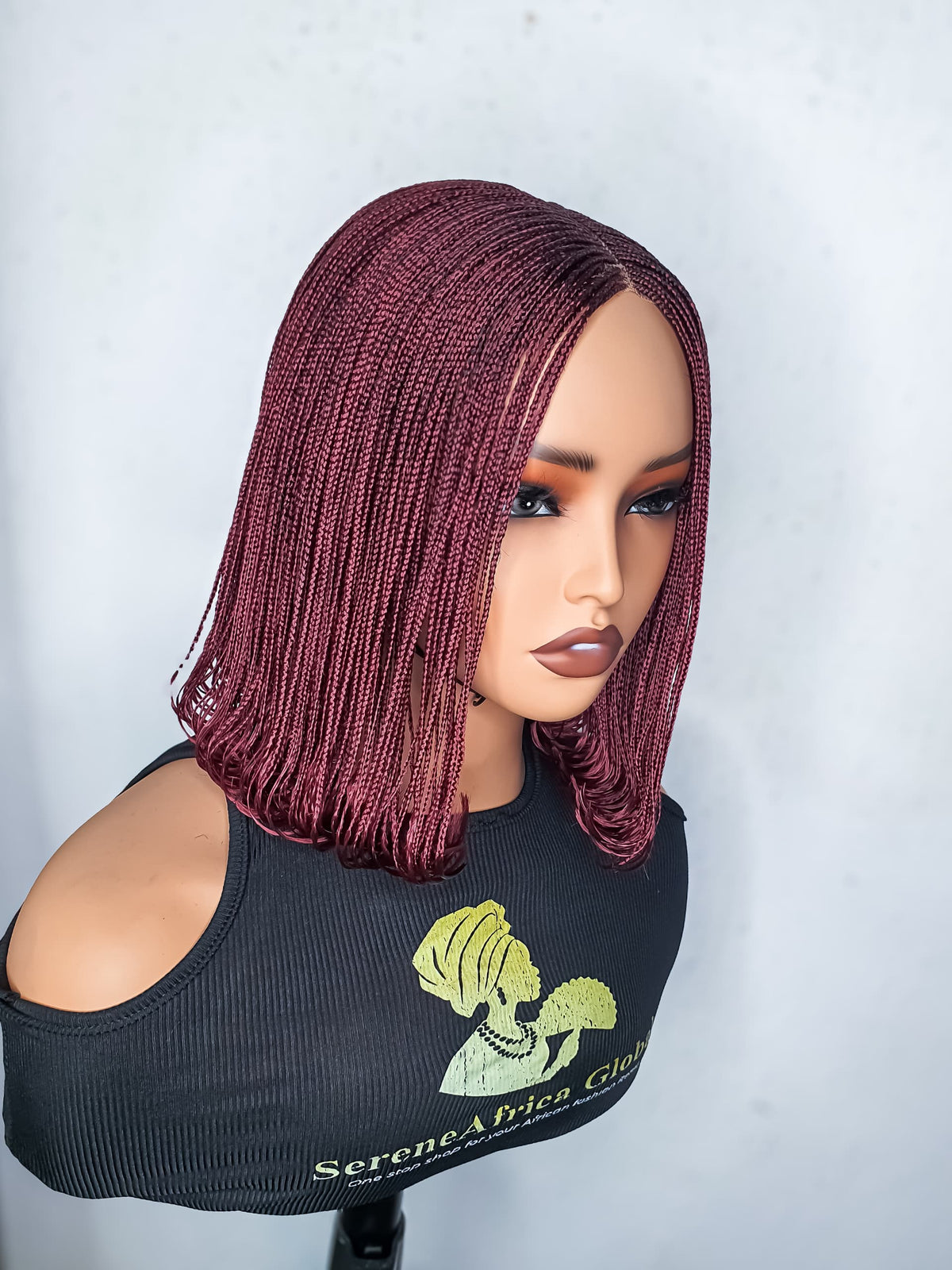 Side view of burgundy small-braid bob wig on mannequin