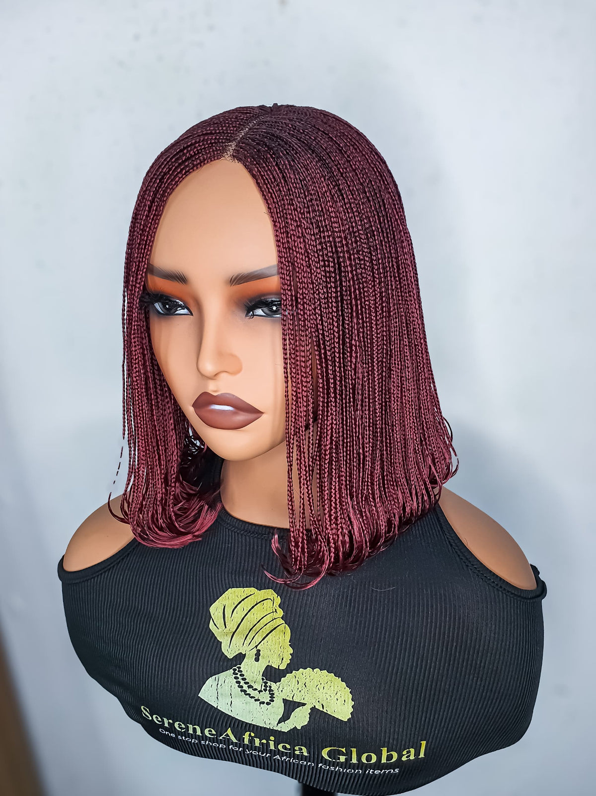 Burgundy bob braided wig with centre part displayed on mannequin