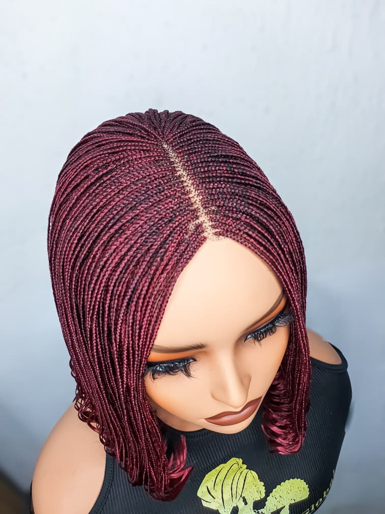 Top view showing centre part of burgundy lace closure bob braided wig