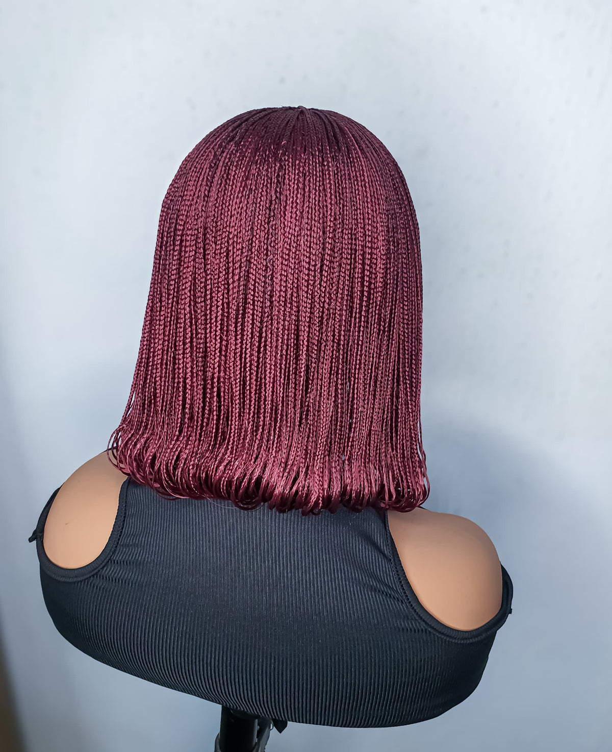 Back view of burgundy bob braided wig with small braids